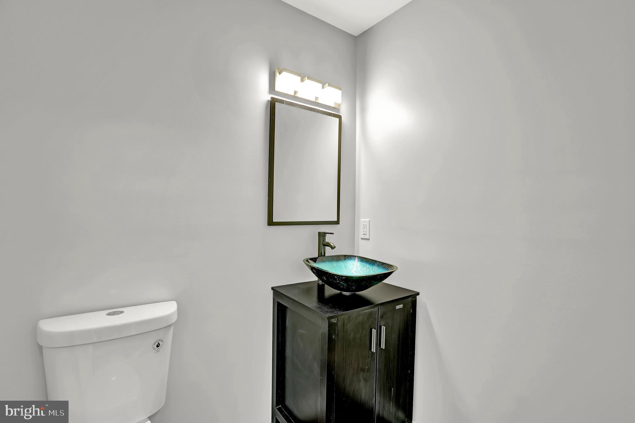 515 Ridge Avenue Hamilton, NJ 08610 - Photo 15 of 30 a bathroom with a toilet sink and mirror