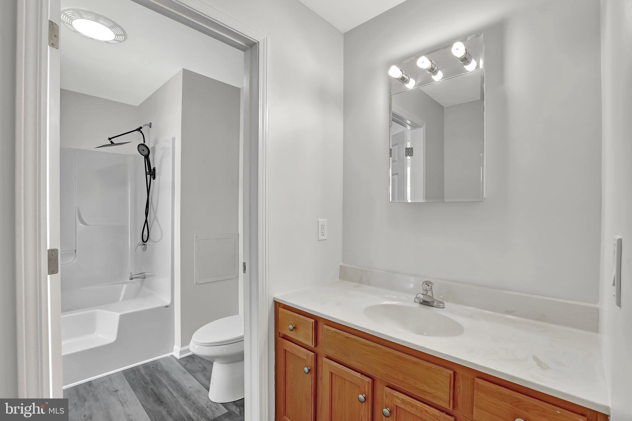 515 Ridge Avenue Hamilton, NJ 08610 - Photo 21 of 30 a bathroom with a sink a toilet and shower