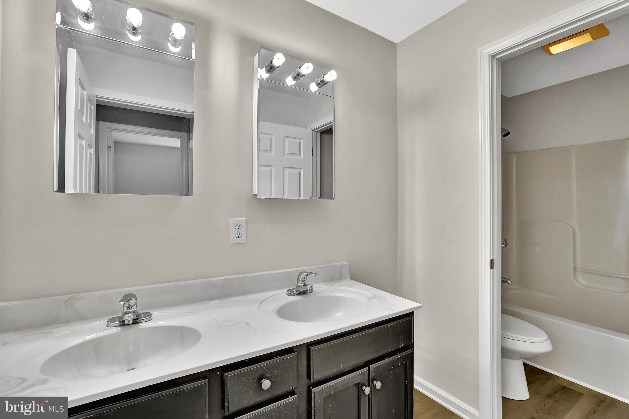 515 Ridge Avenue Hamilton, NJ 08610 - Photo 25 of 30 a bathroom with a sink vanity granite and toilet