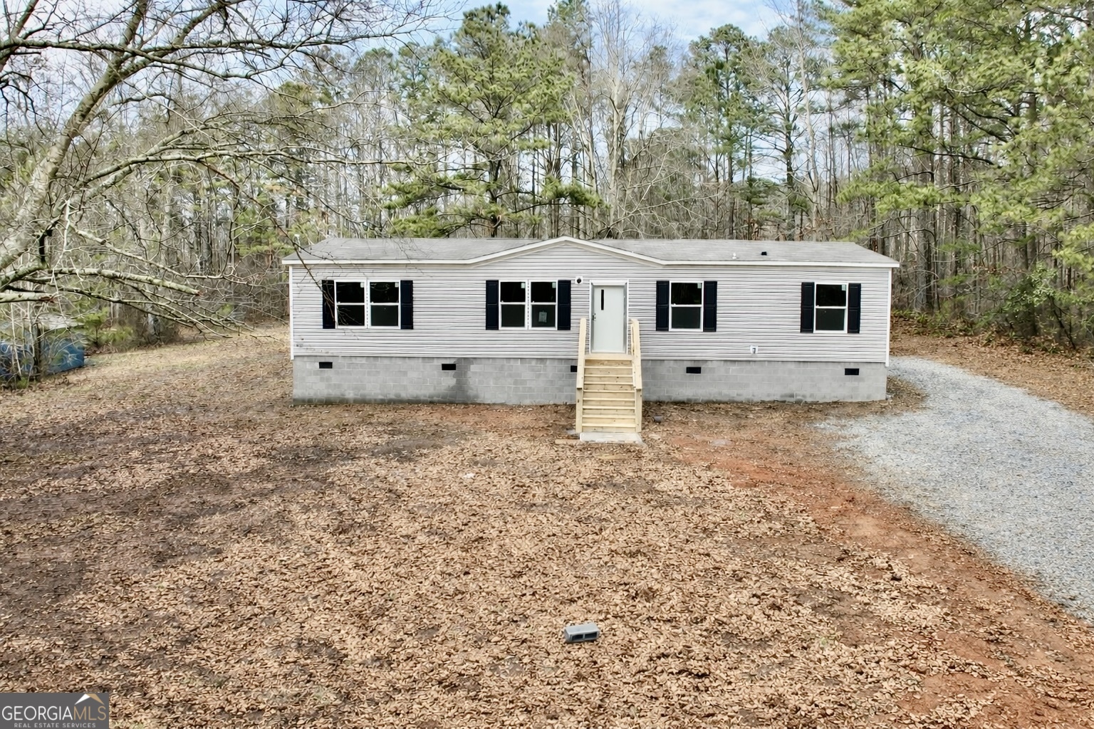 134 Robinson Street Waco, GA 30182 - Photo 1 of 1 a house that has a tree in front of it