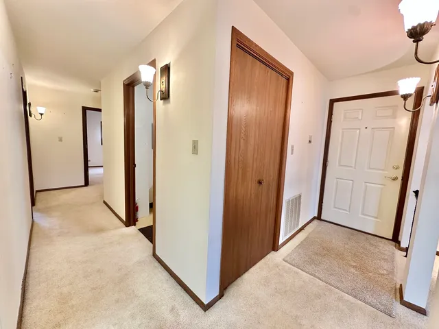 a view of a hallway with closet area
