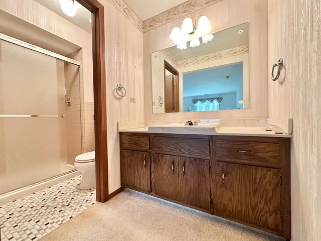 a bathroom with a double vanity sink and a mirror