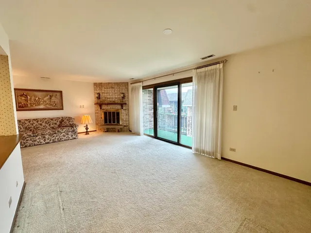 a view of a livingroom with furniture and a ceiling fan