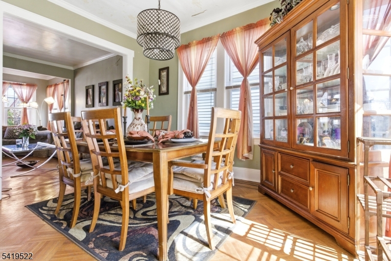 2044 High Street Union, NJ 07083 - Photo 17 of 39 a view of a dining room with furniture large windows and wooden floor