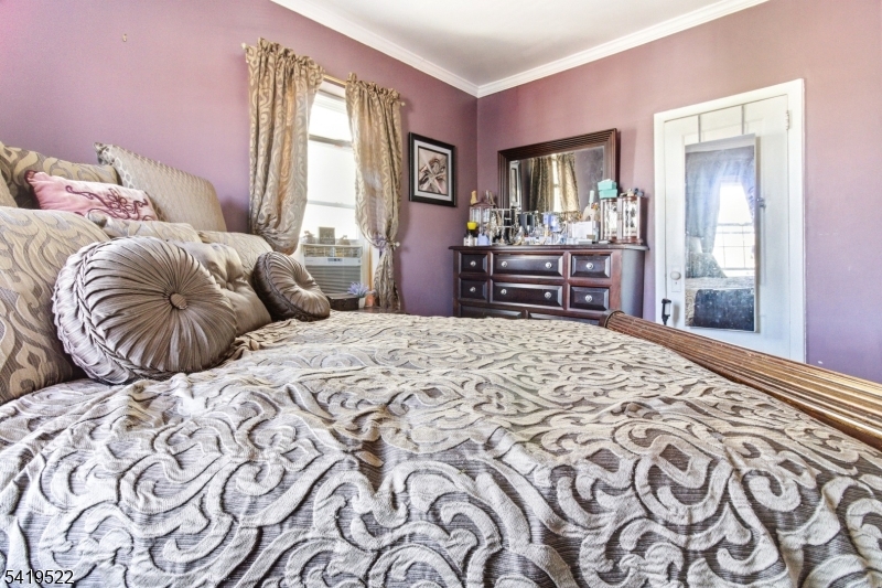 2044 High Street Union, NJ 07083 - Photo 24 of 39 a bedroom with a large bed and a window