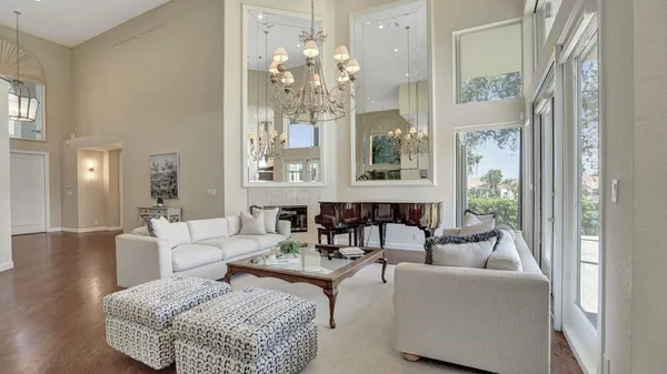 a spacious bedroom with a large bed and a fireplace