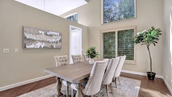 an aerial view of a house with a swimming pool yard and outdoor seating