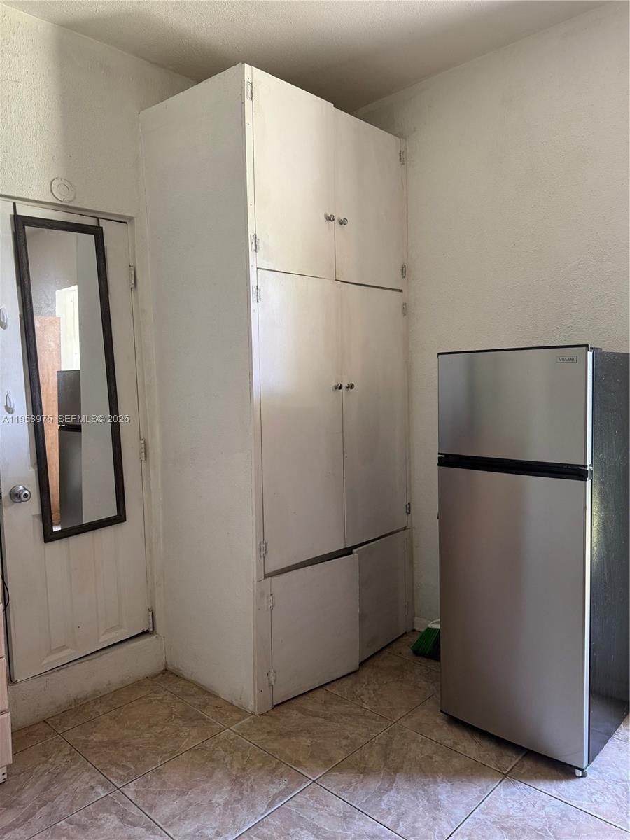 1822 Cleveland Street, Unit 3 Hollywood, FL 33020 - Photo 20 of 35 a view of cabinets and refrigerator