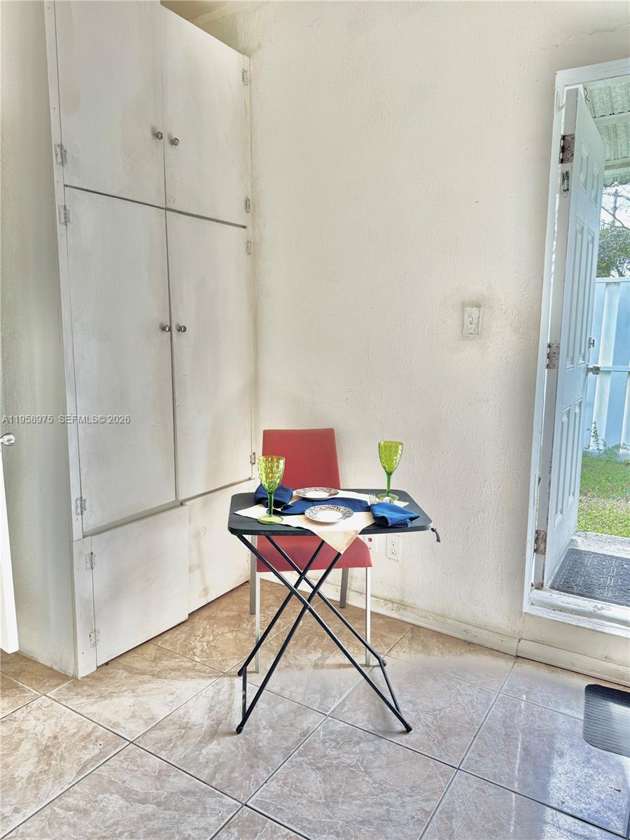 1822 Cleveland Street, Unit 3 Hollywood, FL 33020 - Photo 2 of 35 a workspace with furniture and window