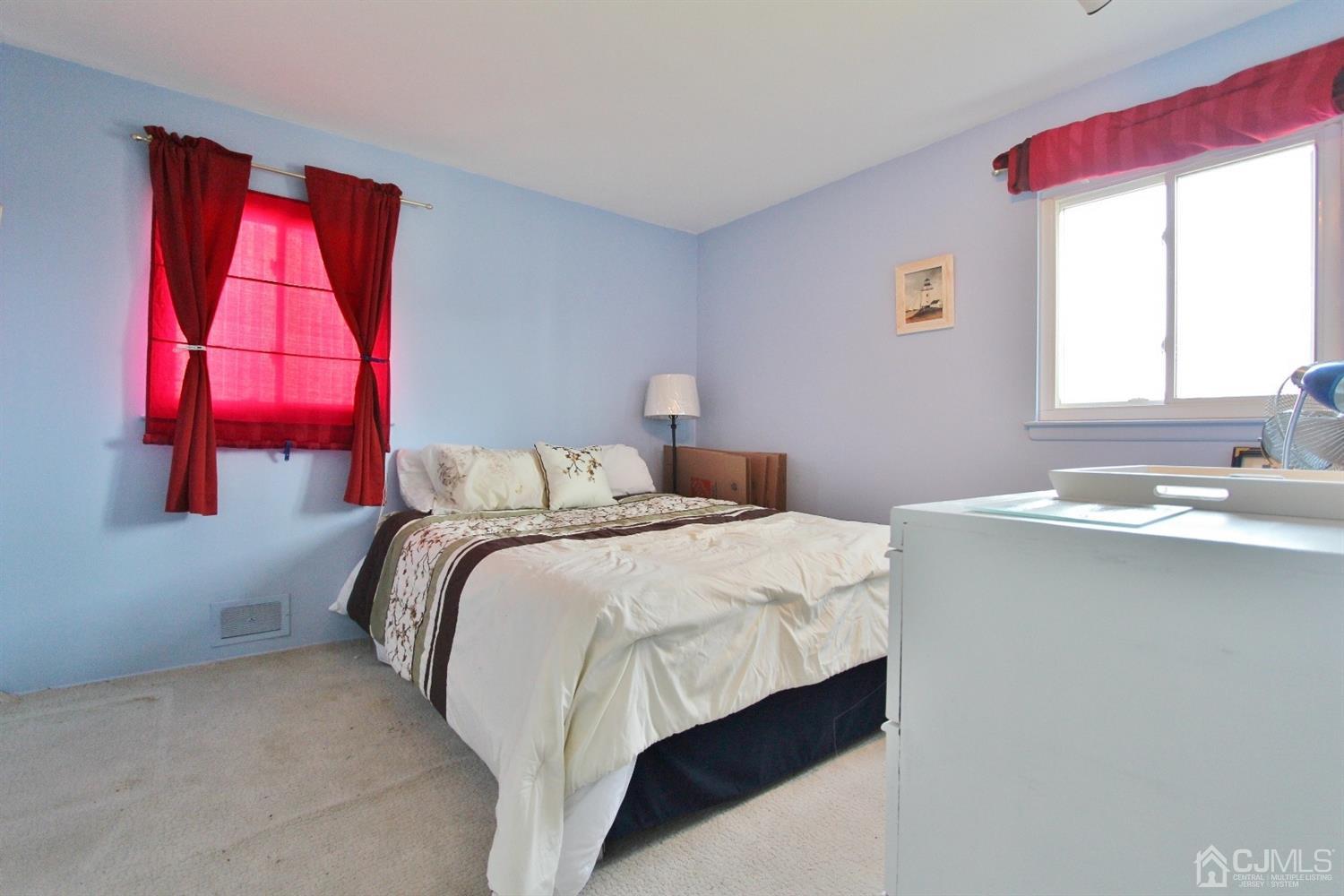 10 Brentwood Road Raritan, NJ 08869 - Photo 8 of 17 a bedroom with a bed and a window