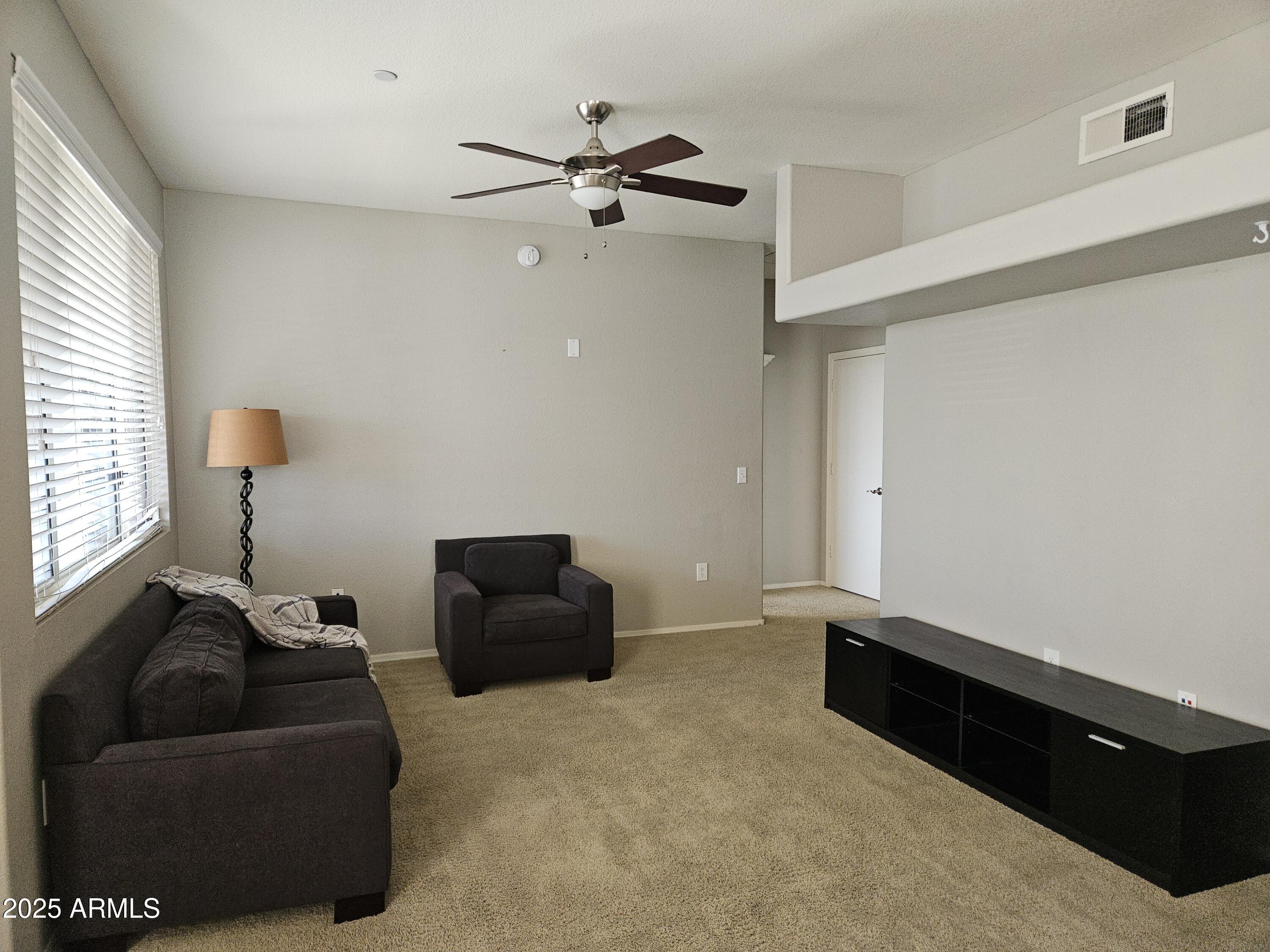 3302 North 7th Street, Unit 332 Phoenix, AZ 85014 - Photo 11 of 33 a living room with furniture
