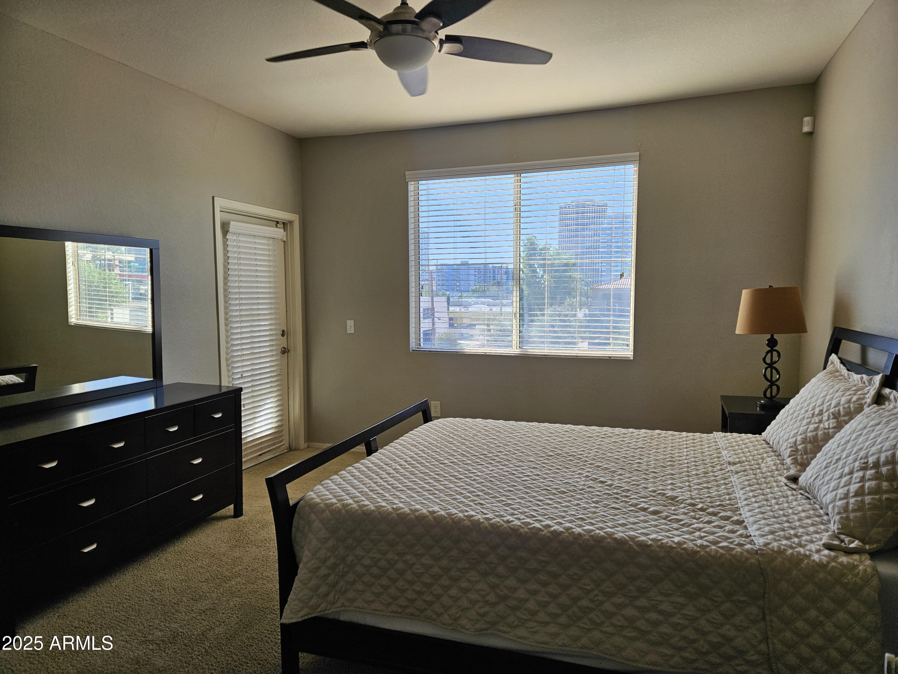 3302 North 7th Street, Unit 332 Phoenix, AZ 85014 - Photo 13 of 33 a bedroom with a bed and a window