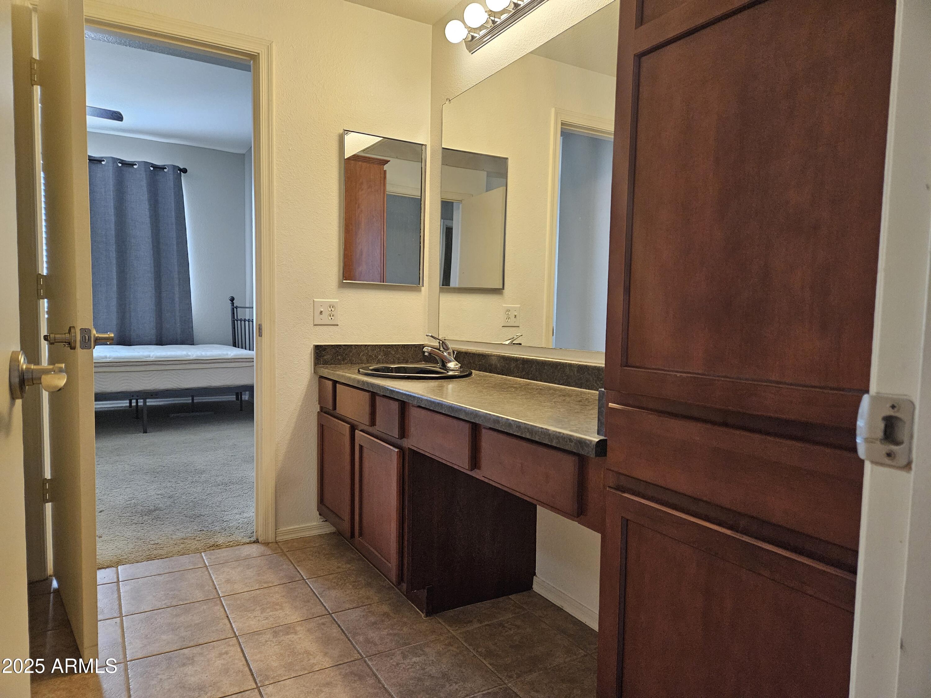 3302 North 7th Street, Unit 332 Phoenix, AZ 85014 - Photo 19 of 33 a bathroom with a sink and a mirror