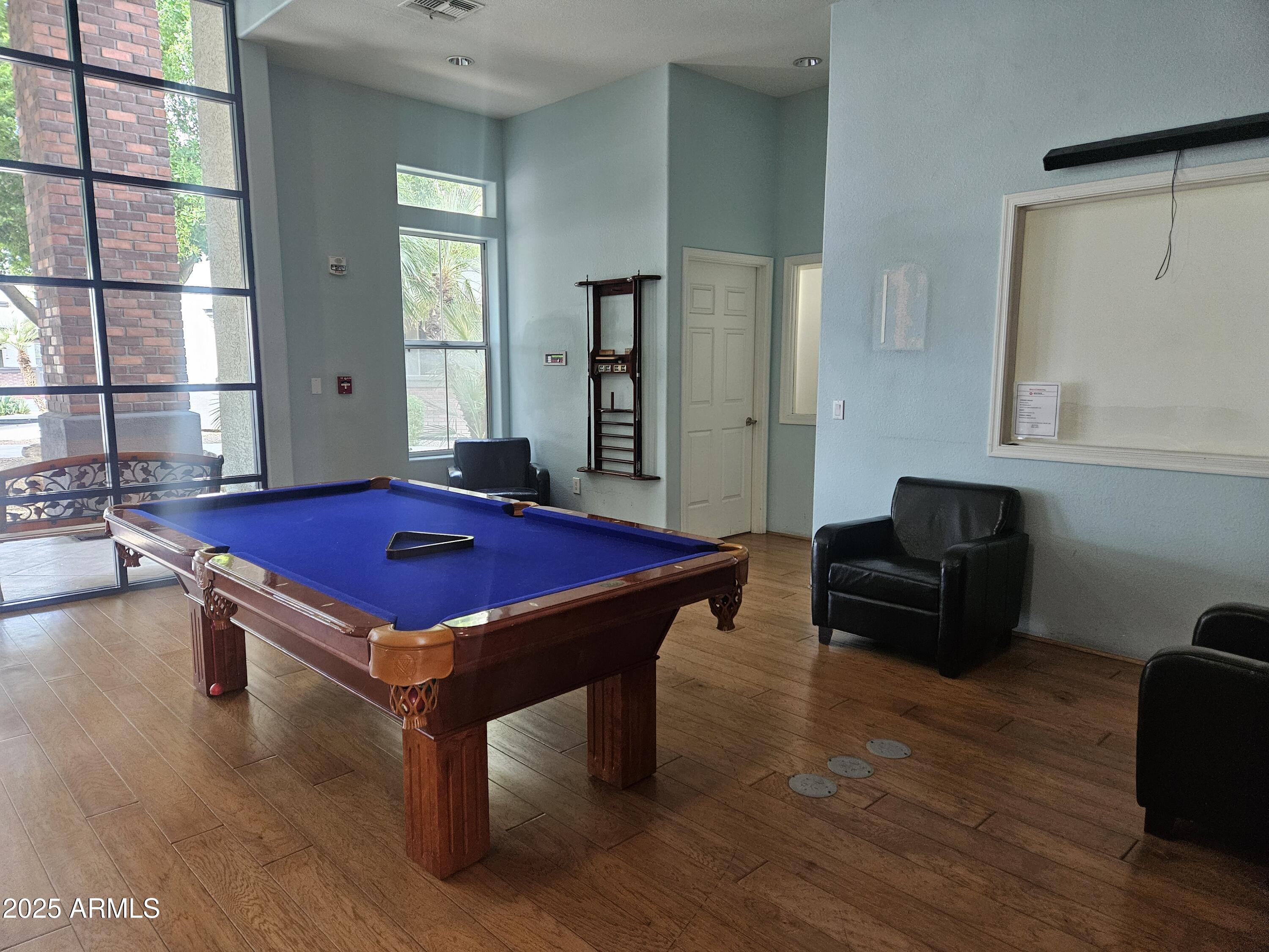 3302 North 7th Street, Unit 332 Phoenix, AZ 85014 - Photo 29 of 33 a room with pool table and windows