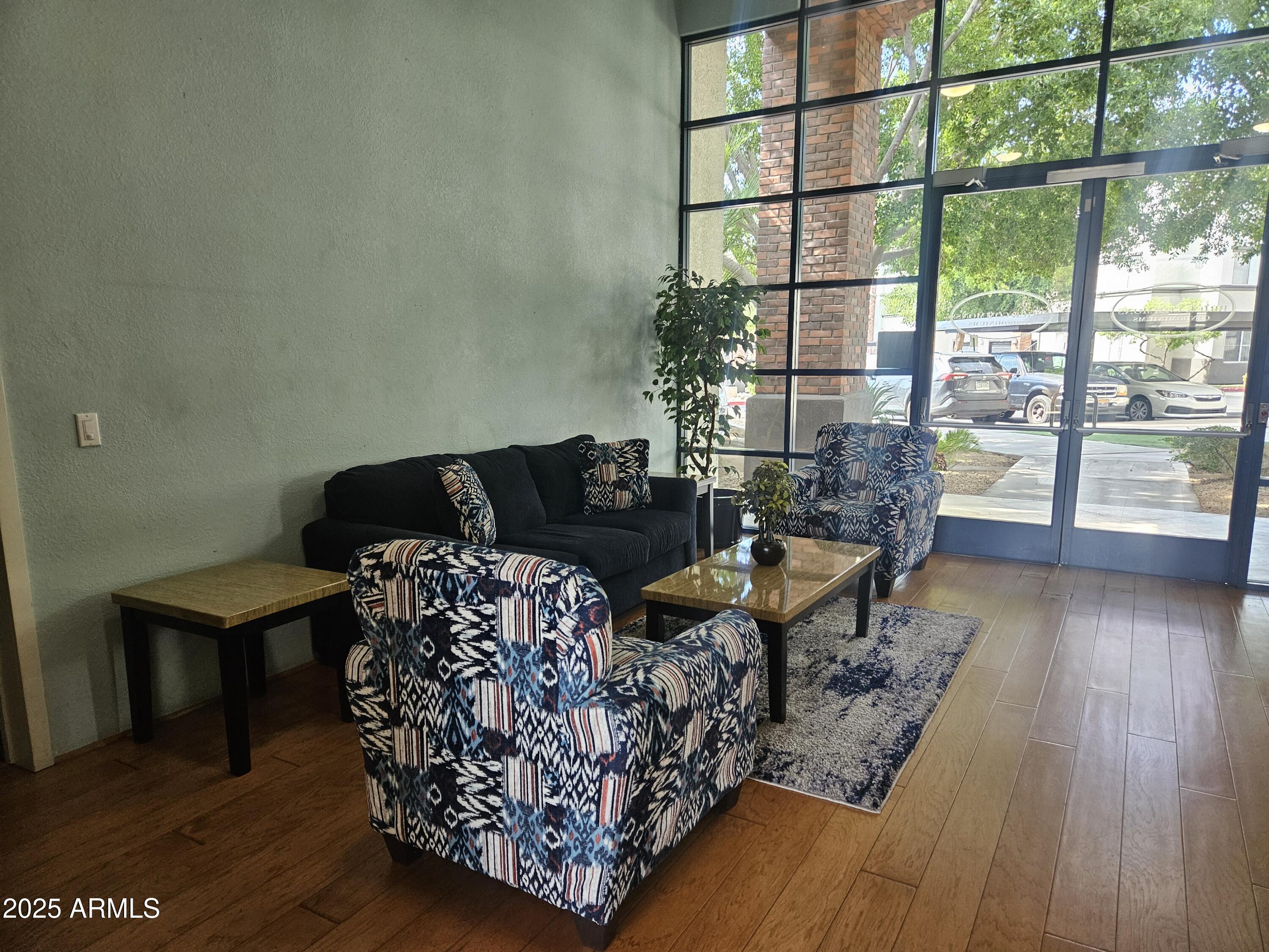 3302 North 7th Street, Unit 332 Phoenix, AZ 85014 - Photo 30 of 33 a living room with furniture large window and wooden floor