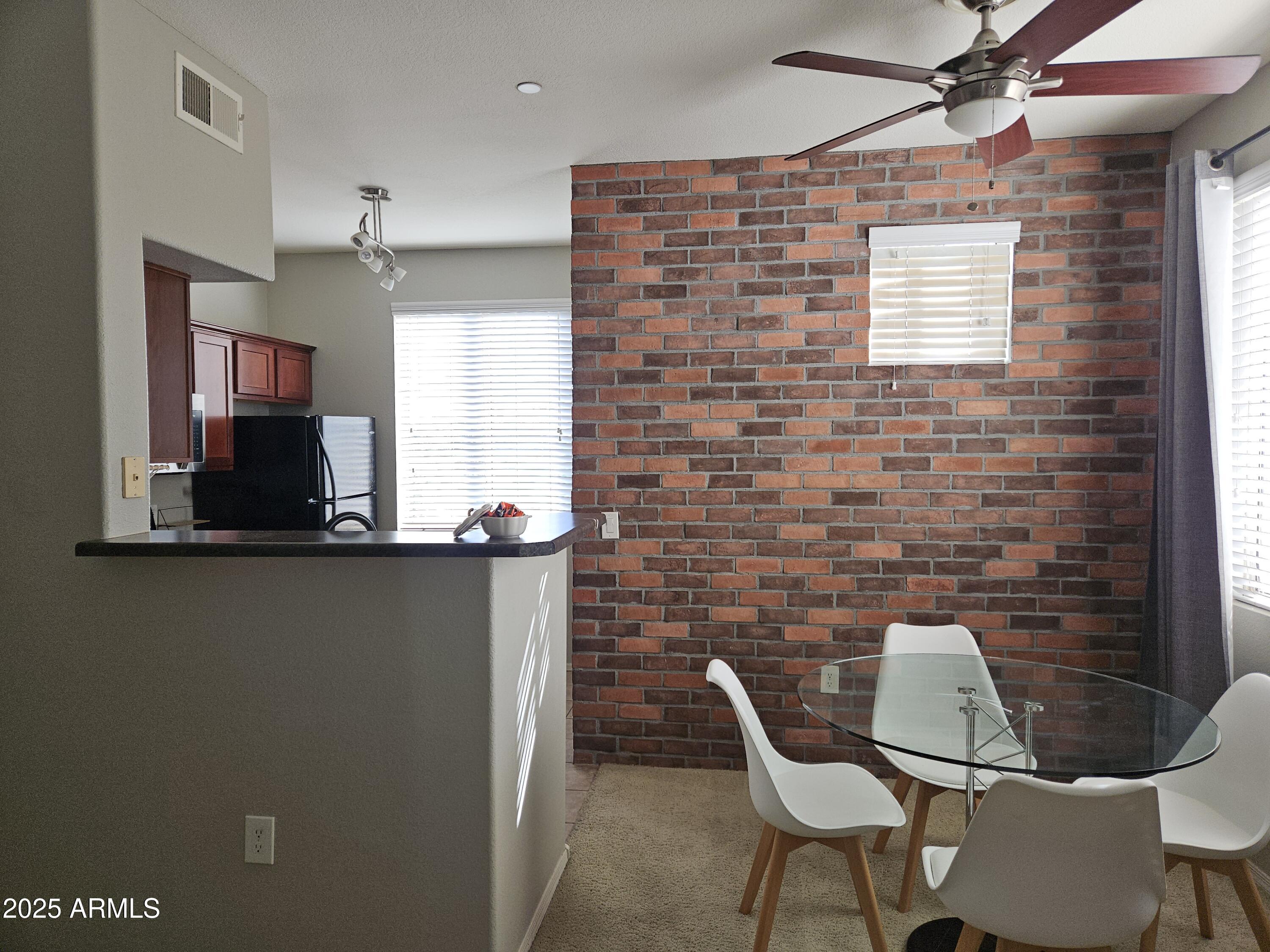 3302 North 7th Street, Unit 332 Phoenix, AZ 85014 - Photo 4 of 33 a dining room with furniture and window