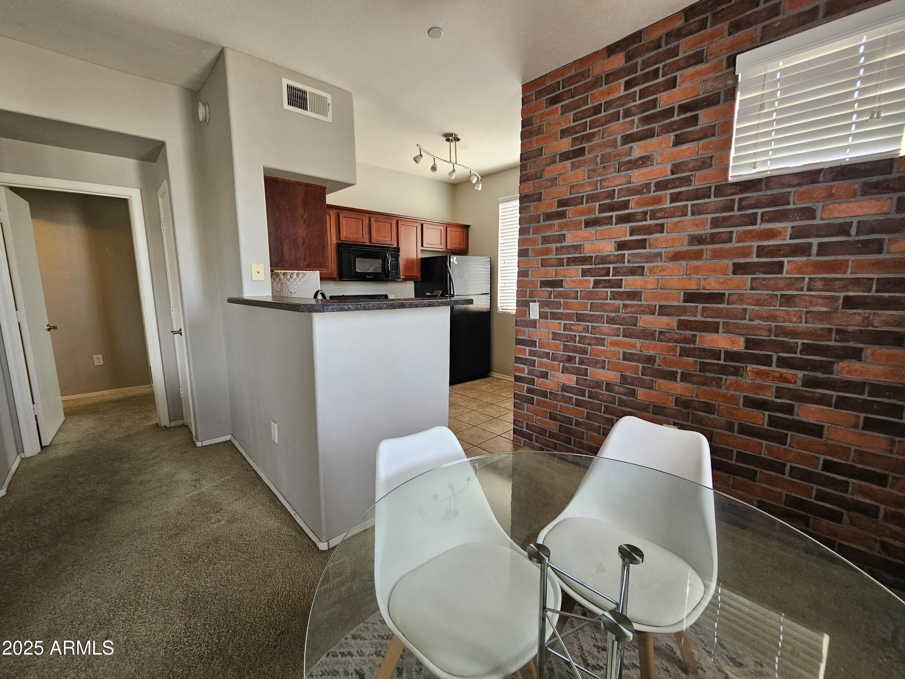 3302 North 7th Street, Unit 332 Phoenix, AZ 85014 - Photo 5 of 33 a dining room with furniture