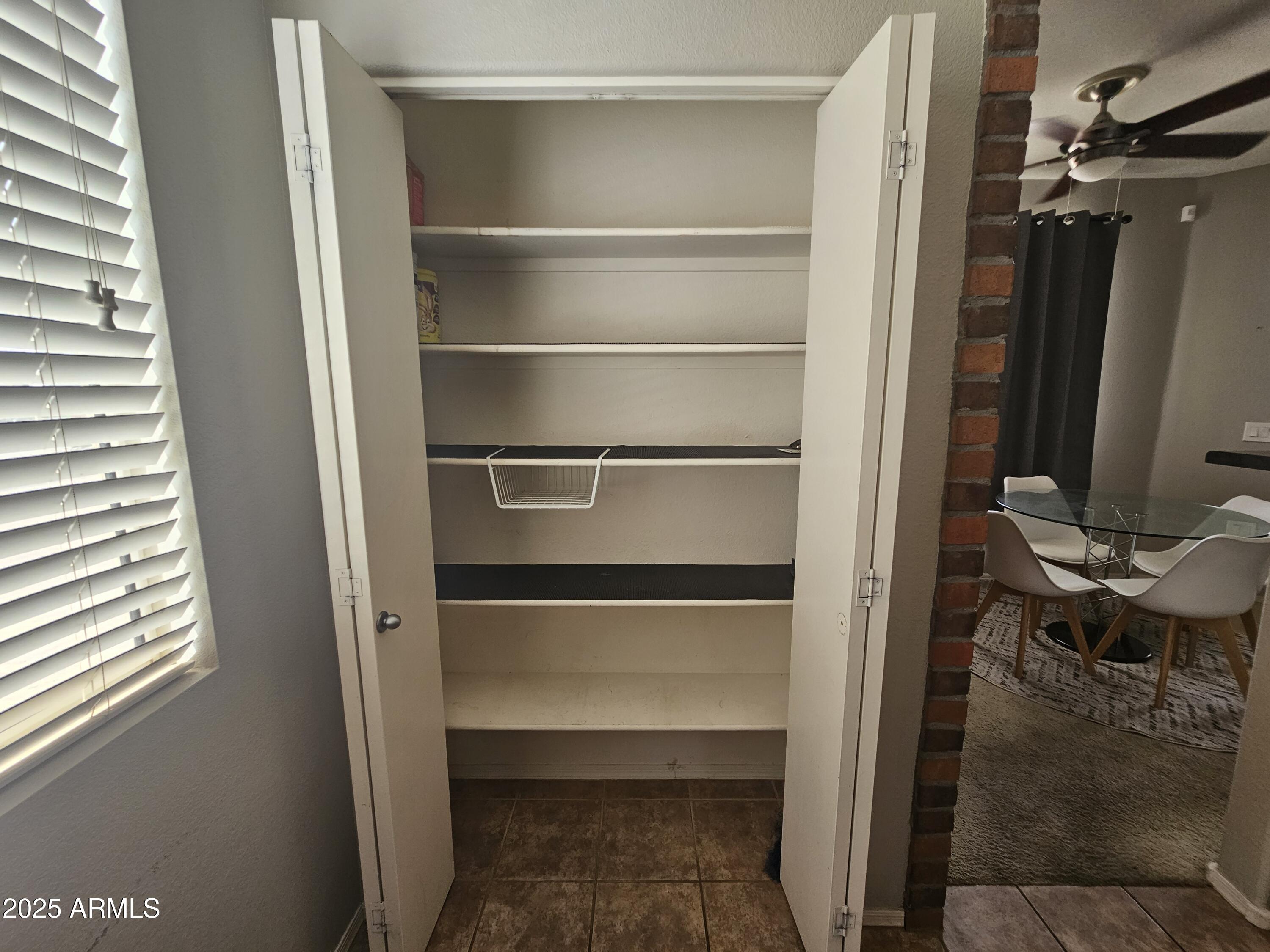 3302 North 7th Street, Unit 332 Phoenix, AZ 85014 - Photo 10 of 33 a view of walk in closet with empty racks