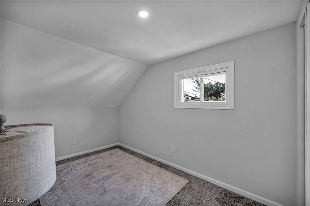 4649 Burleigh Road Cleveland, OH 44125 - Photo 26 of 37 Bonus room featuring carpet flooring and vaulted ceiling