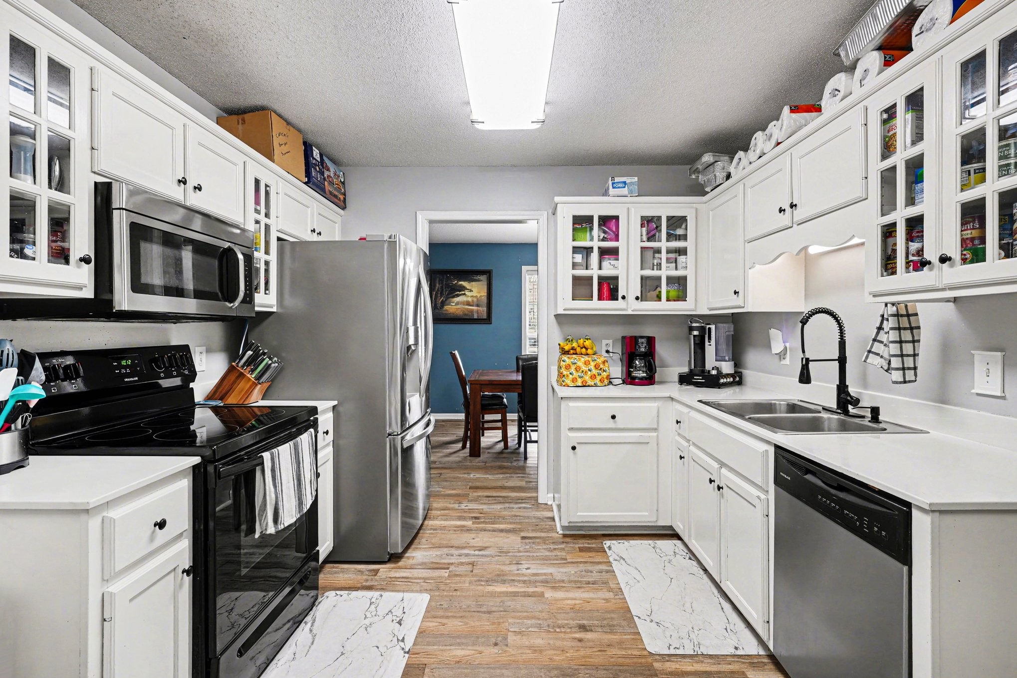 3475 Eastridge Road Woodlawn, TN 37191 - Photo 8 of 28 a kitchen with stainless steel appliances granite countertop a stove and cabinets