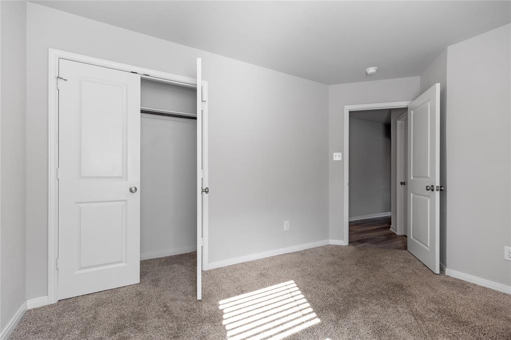 3933 Rimfire Road Waco, TX 76705 - Photo 13 of 27 a view of an empty room and closet area