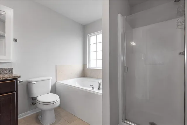 a bathroom with a toilet a sink and a mirror