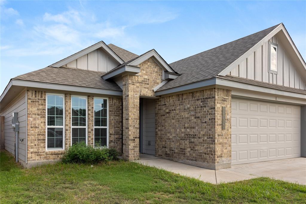 3933 Rimfire Road Waco, TX 76705 - Photo 26 of 27 a front view of a house with garden