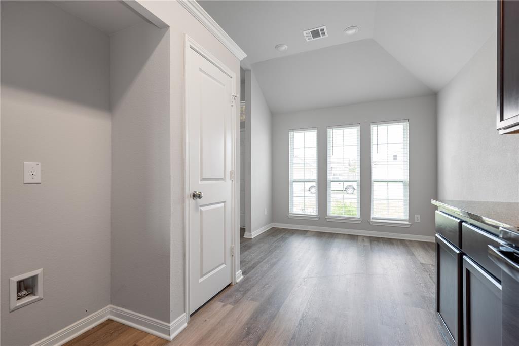 3933 Rimfire Road Waco, TX 76705 - Photo 5 of 27 wooden floor in an empty room with a window