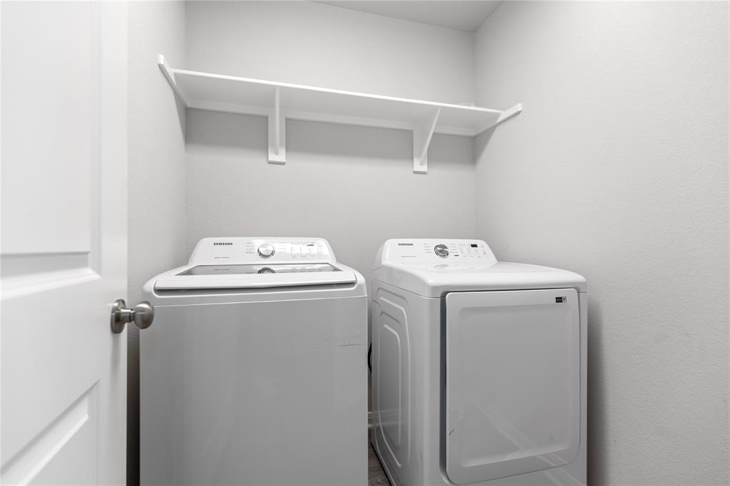 3933 Rimfire Road Waco, TX 76705 - Photo 8 of 27 a utility room with dryer and washer