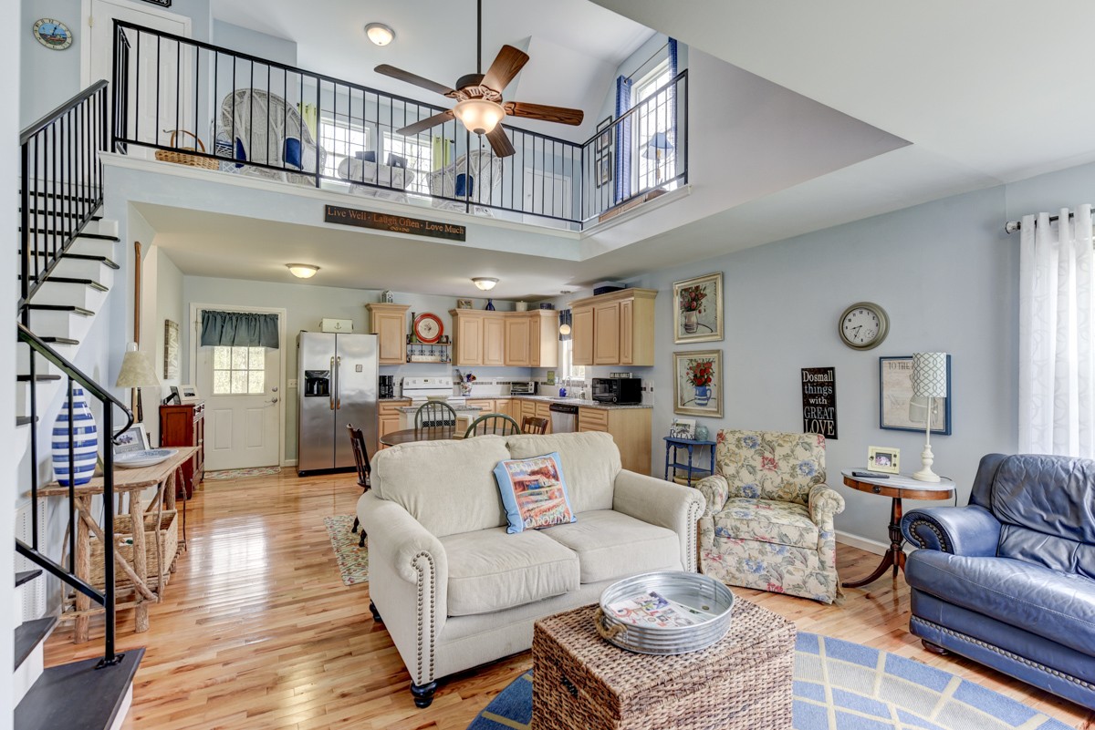 8565 South Tatum Creek Road Lyles, TN 37098 - Photo 23 of 31 a living room with furniture a ceiling fan a rug and a window