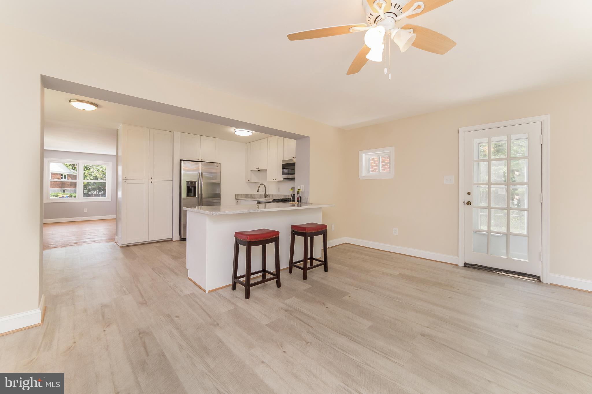 917 Benson Terrace Silver Spring, MD 20901 - Photo 11 of 25 a view of kitchen with furniture and wooden floor