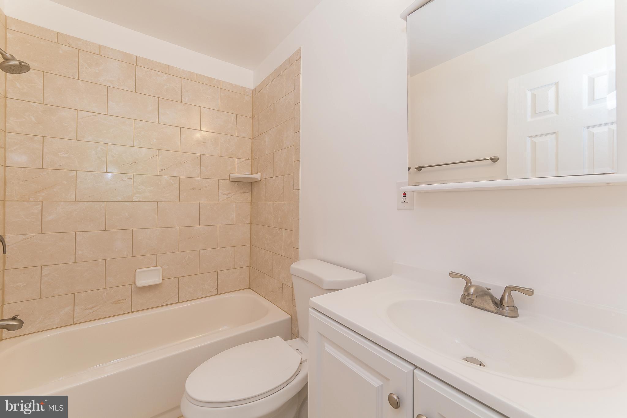 917 Benson Terrace Silver Spring, MD 20901 - Photo 12 of 25 a bathroom with a sink a toilet and bathtub
