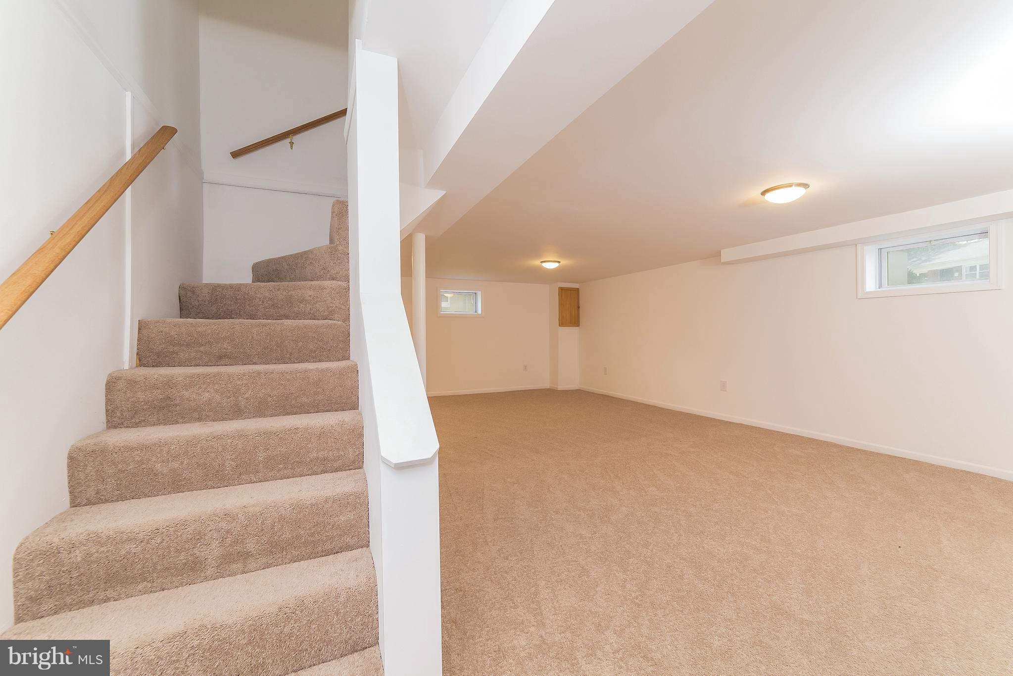 917 Benson Terrace Silver Spring, MD 20901 - Photo 14 of 25 a view of an empty room with stairs