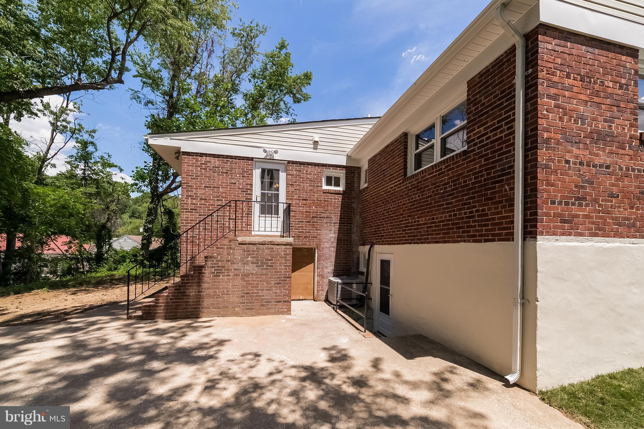 917 Benson Terrace Silver Spring, MD 20901 - Photo 23 of 25 a front view of a house with a yard