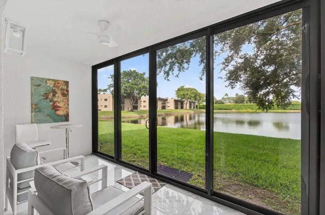 a view of living room with furniture and garden view