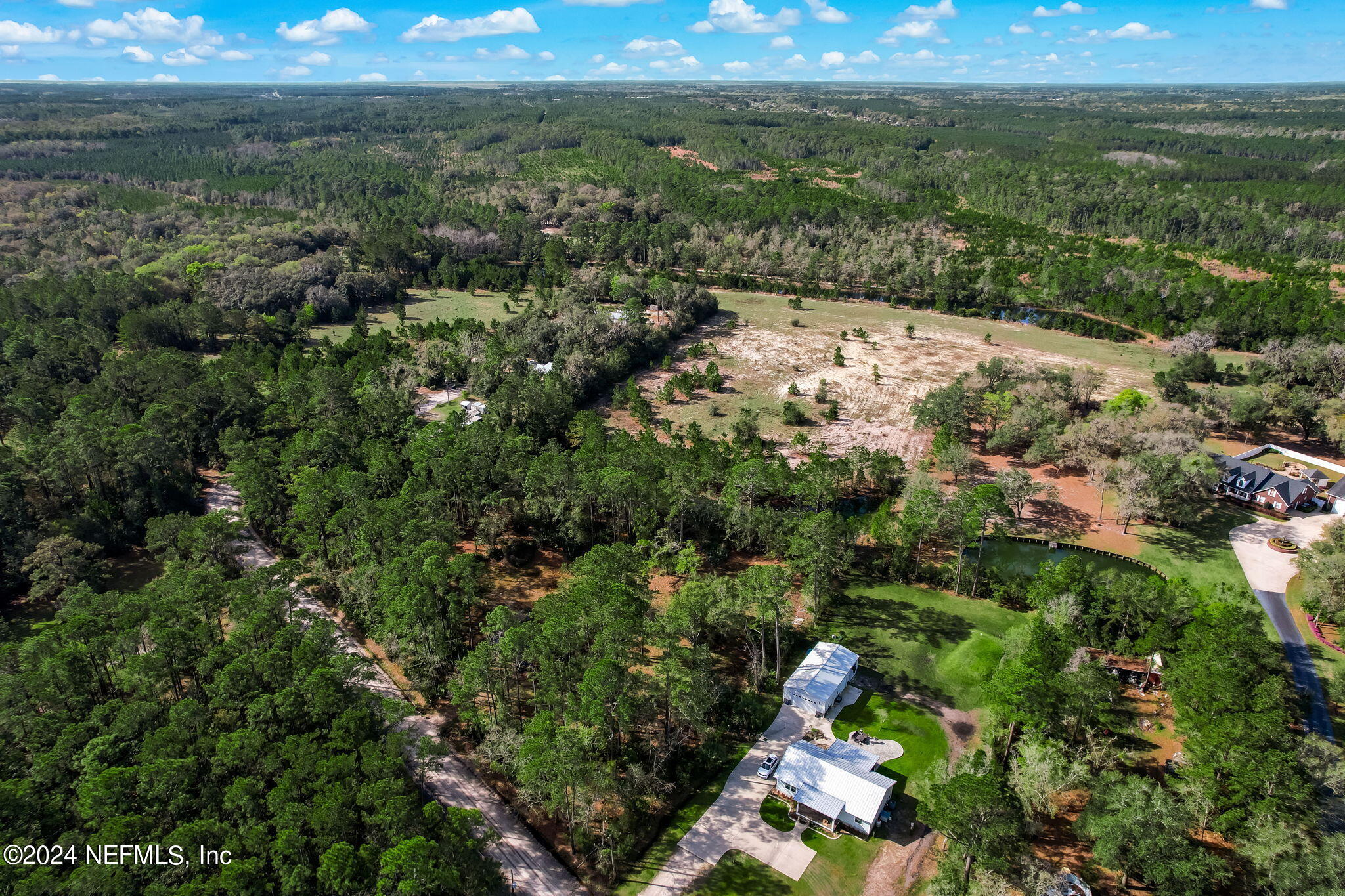 87273 Raddin Road Yulee, FL 32097 - Photo 13 of 14 an aerial view of mountain with yard