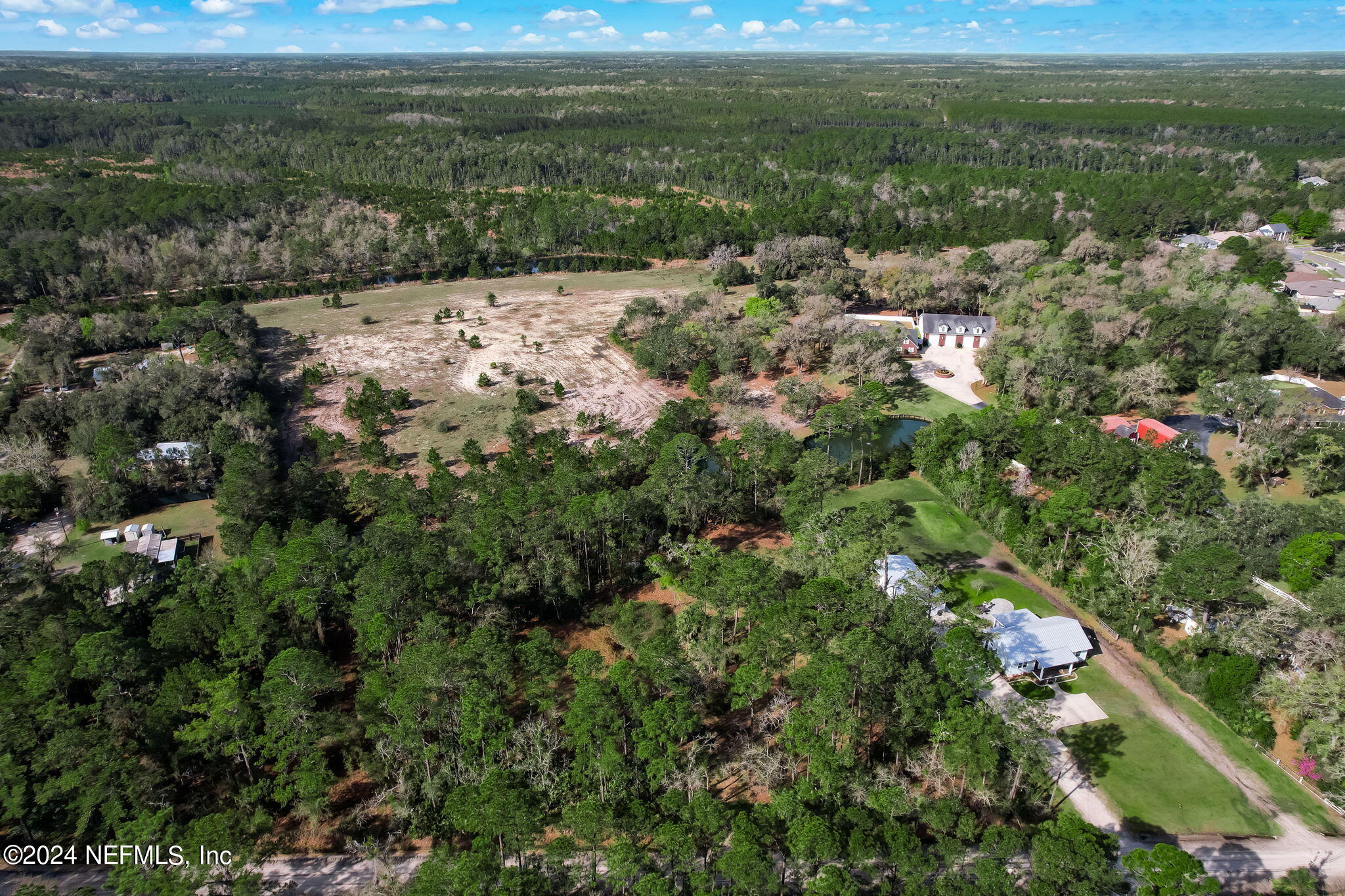 87273 Raddin Road Yulee, FL 32097 - Photo 5 of 14 a view of a field with a forest