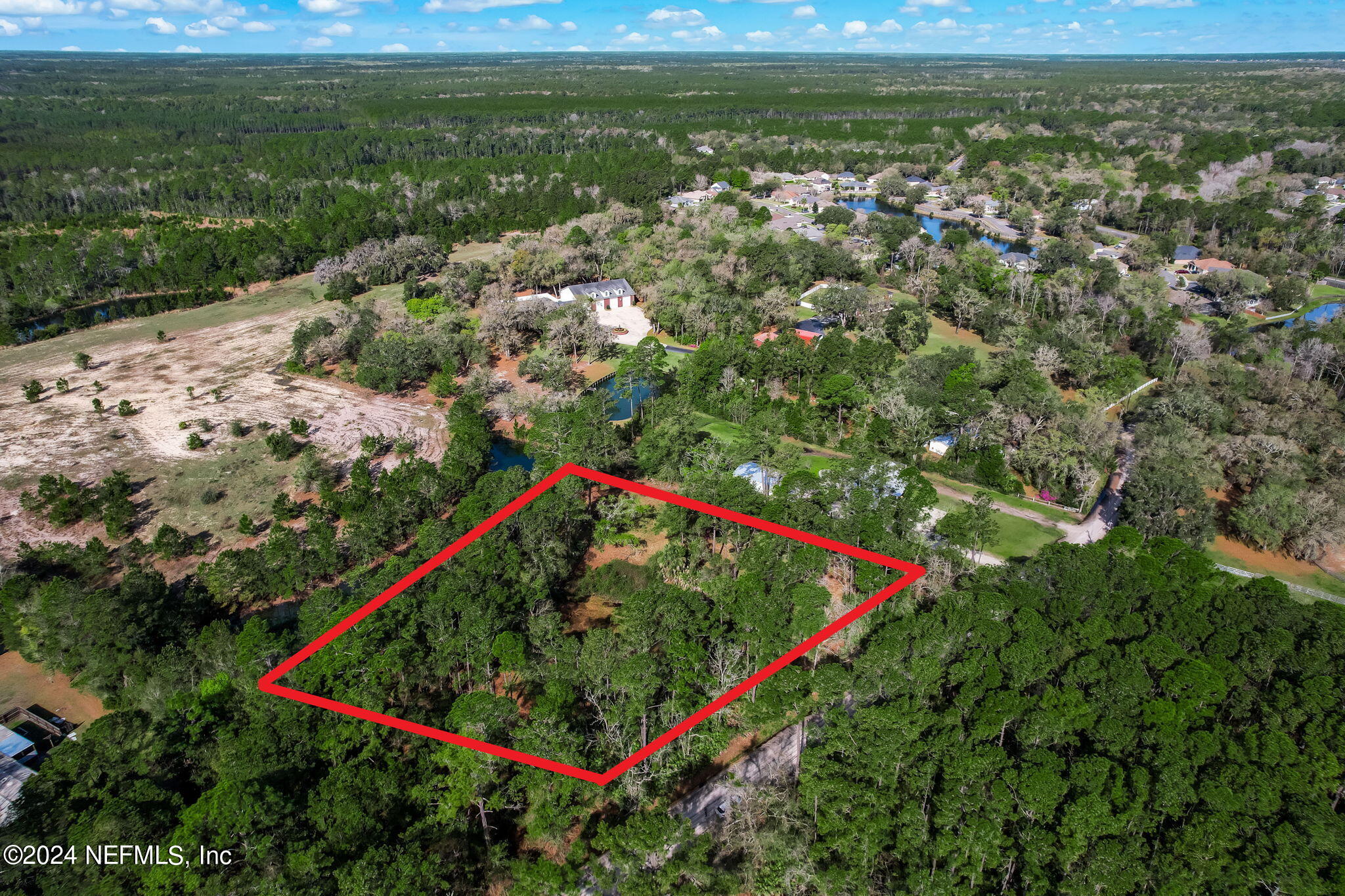 87273 Raddin Road Yulee, FL 32097 - Photo 10 of 14 a view of a lush green field