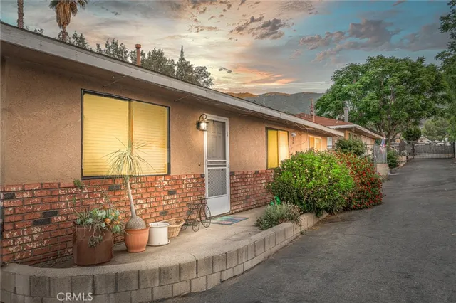 a view of a porch with potted plants