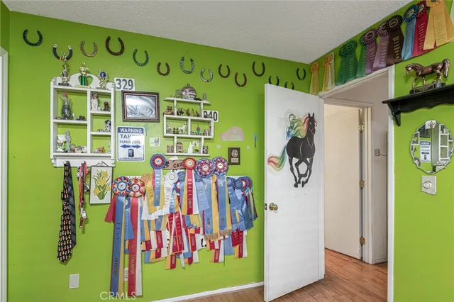 a view of an entryway with wooden floor
