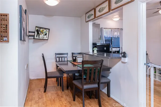 a view of a dining room with furniture and a mirror