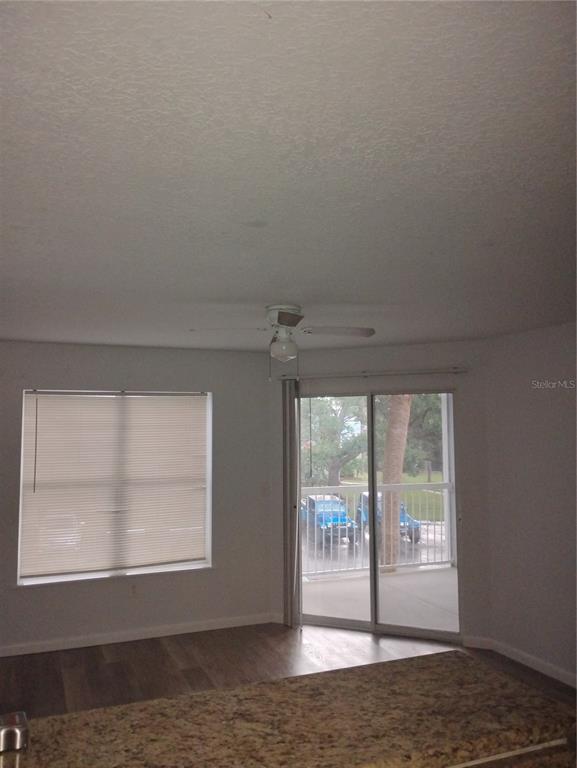 2549 Grassy Point Drive, Unit 203 Lake Mary, FL 32746 - Photo 11 of 22 a view of empty room with floor to ceiling window