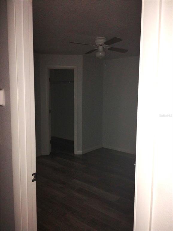 2549 Grassy Point Drive, Unit 203 Lake Mary, FL 32746 - Photo 12 of 22 a view of a hallway with wooden floor