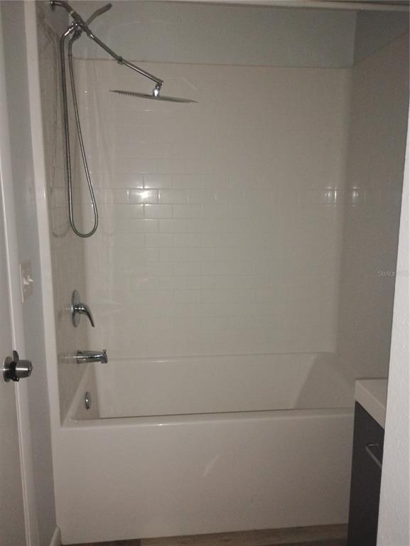 2549 Grassy Point Drive, Unit 203 Lake Mary, FL 32746 - Photo 16 of 22 a bathroom with a bathtub