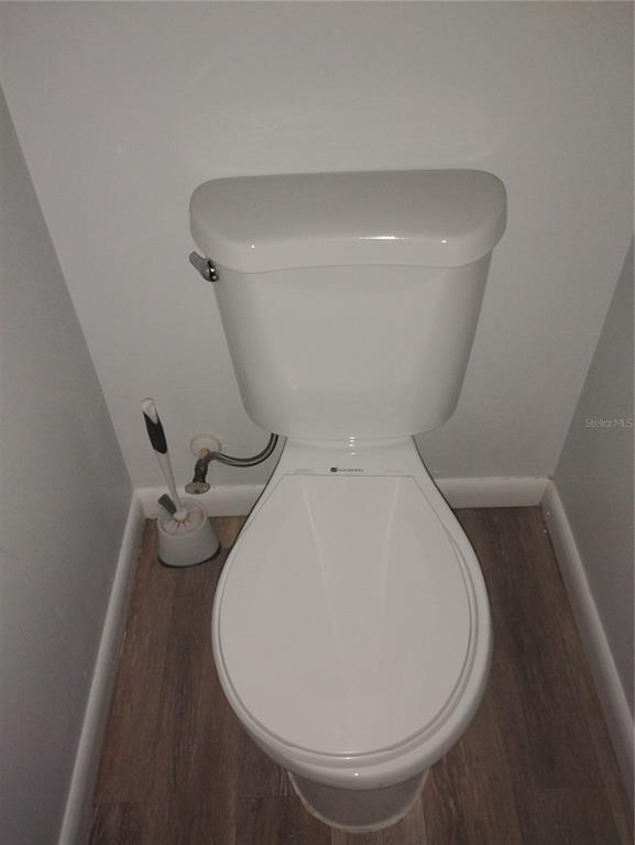 2549 Grassy Point Drive, Unit 203 Lake Mary, FL 32746 - Photo 17 of 22 a close view of a toilet in a bathroom