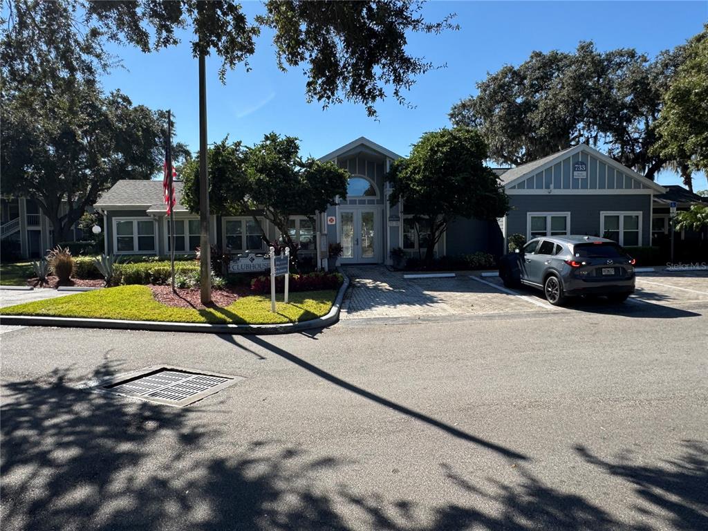 2549 Grassy Point Drive, Unit 203 Lake Mary, FL 32746 - Photo 19 of 22 a view of a house with swimming pool and a yard