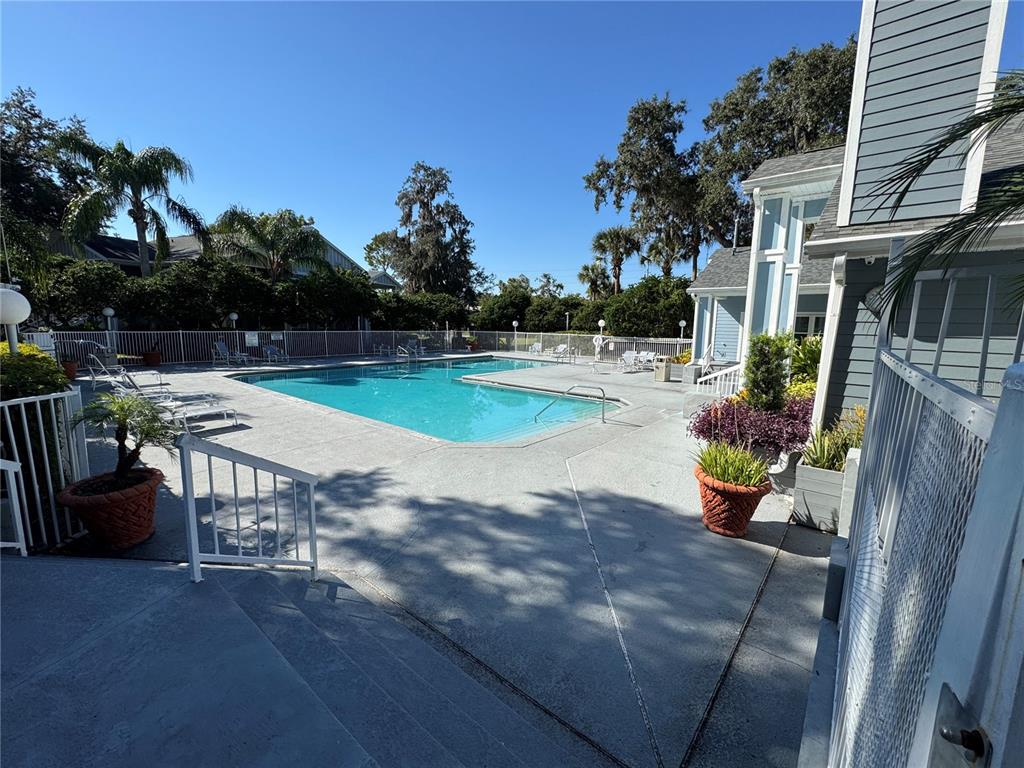 2549 Grassy Point Drive, Unit 203 Lake Mary, FL 32746 - Photo 20 of 22 a view of a backyard with sitting area