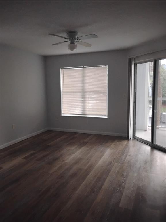 2549 Grassy Point Drive, Unit 203 Lake Mary, FL 32746 - Photo 4 of 22 an empty room with wooden floor and windows