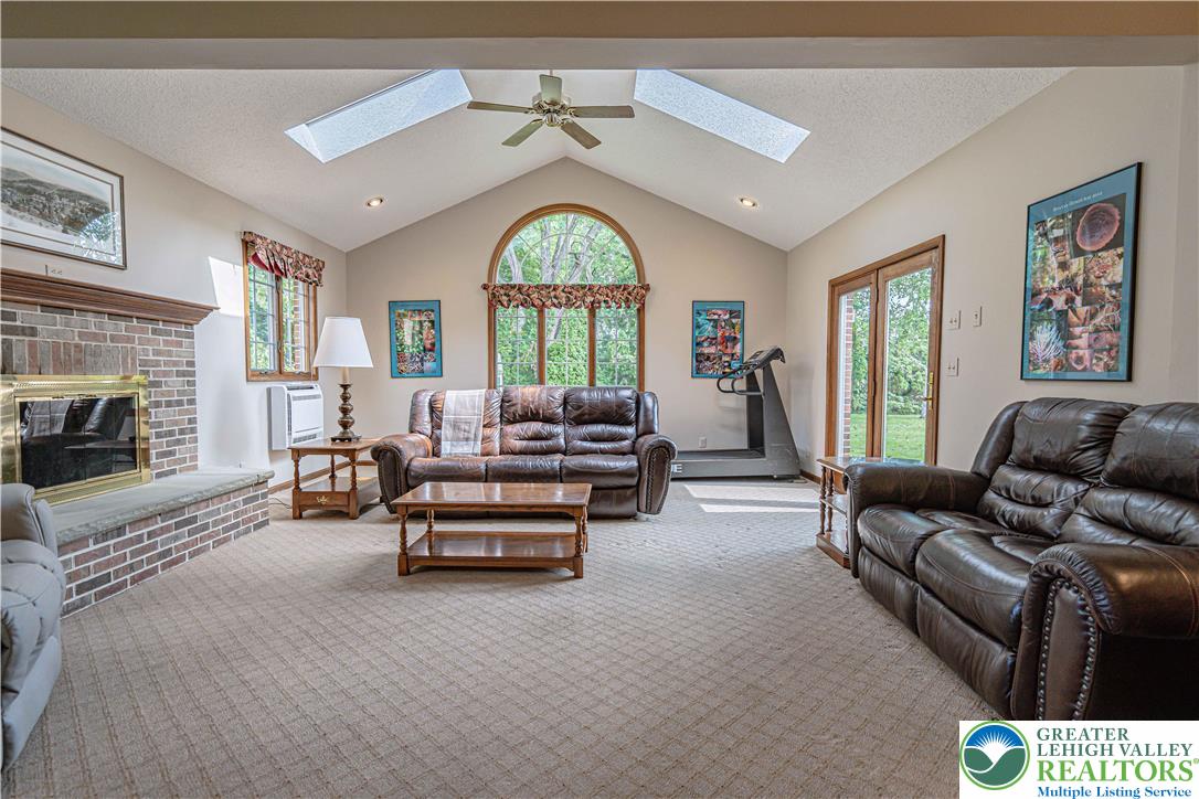 1434 Colgate Drive Bethlehem, PA 18017 - Photo 20 of 37 a living room with furniture fireplace and a large window