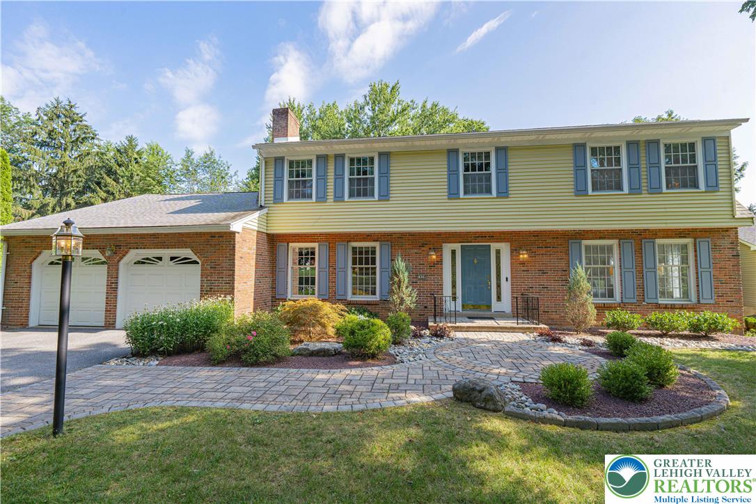 1434 Colgate Drive Bethlehem, PA 18017 - Photo 2 of 37 a front view of a house with a yard and potted plants